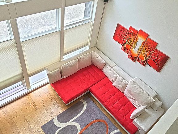 Awesome loft style living with floating stair treads and ton