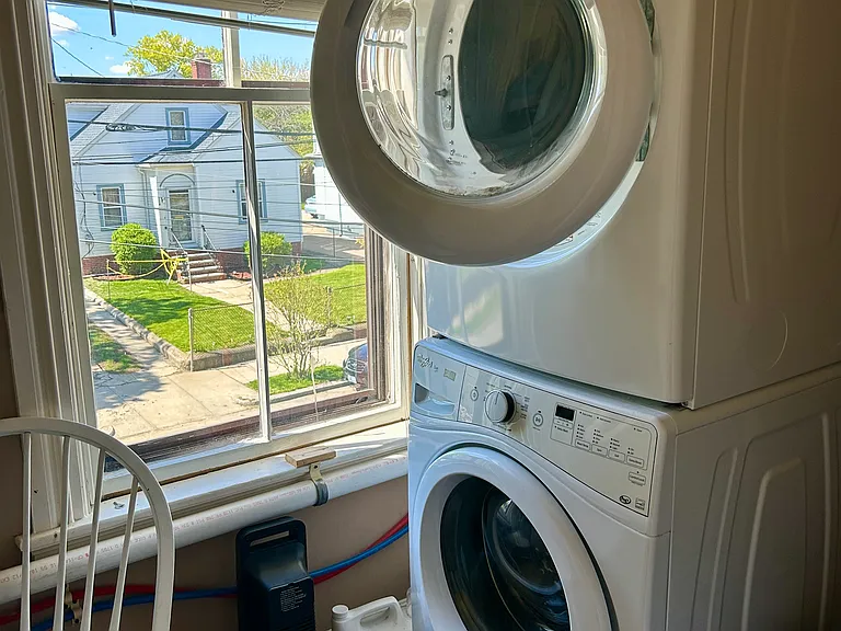 Laundry room on second floor rear landing. It is shared with the second floor apartment.