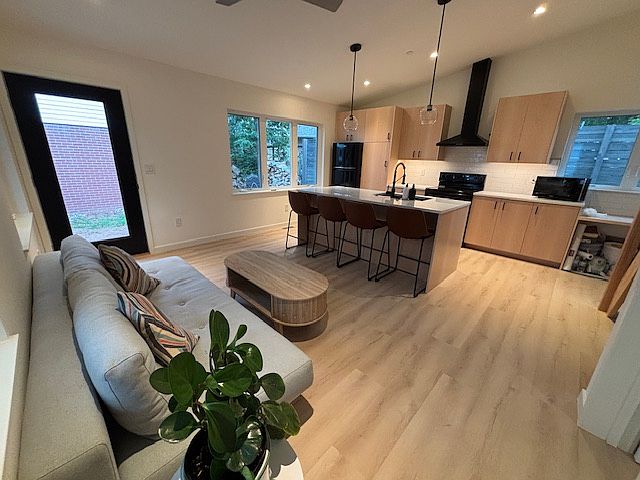 Kitchen with island, desk for work.
