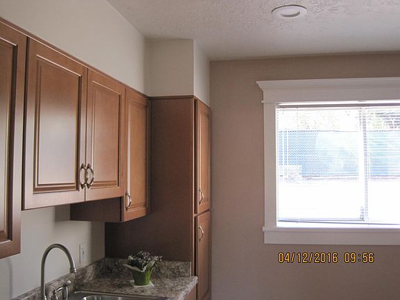 Window Moldings & Accent walls in Kitchen & Living Room. Moldings are the same & the accent walls are also the same lovely color in both rooms.