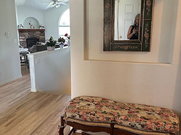 Foyer welcome bench against powder room wall.