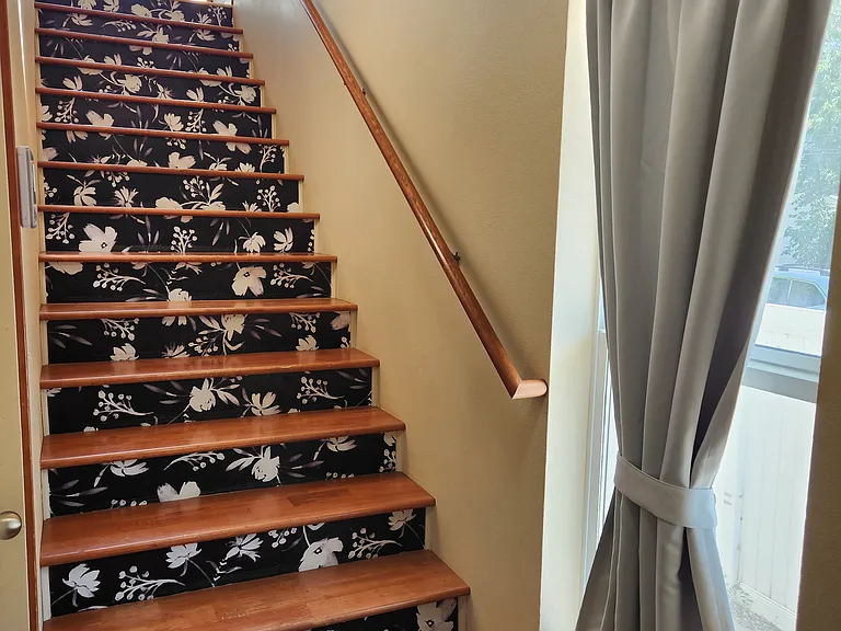 Entry way - leads to upstairs and also to the entry level bedroom with attached .5 bath. Garage entrance is also here.
