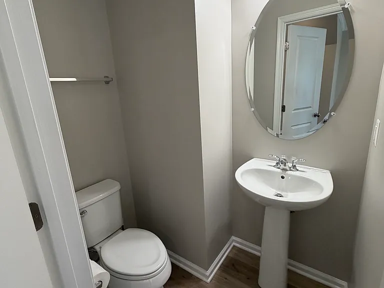 Second floor with kitchen, living area and half bath