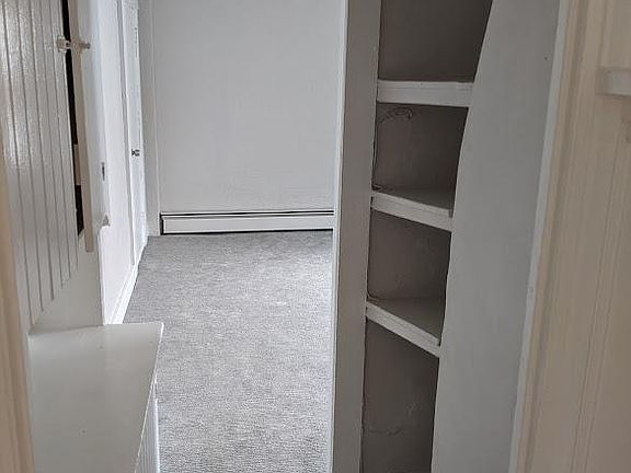 Storage shelves and cabinets in hall
