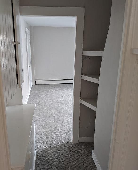 Storage shelves and cabinets in hall