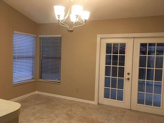 Eat in kitchen with door leading to screened in porch