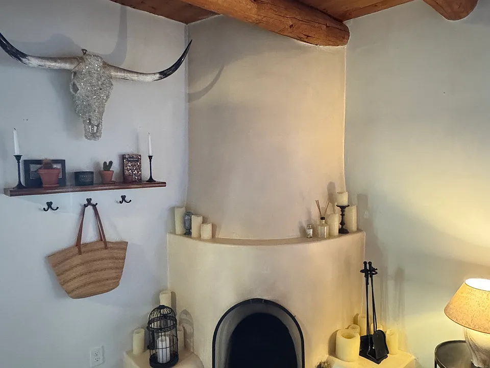 Cozy working Kiva fireplace adds warmth and historical character.