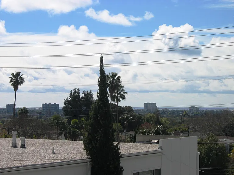 View from front, west facing window. You only share one common wall.