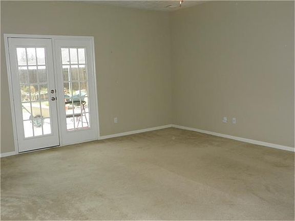 There are french doors that lead out to an expanded patio area.