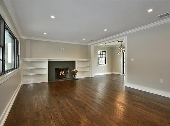 The bright living room flows into the dining room which leads into the kitchen. Perfect for entertaining!