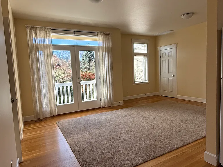 Living/Dining looking towards Balcony and Laundry Room.