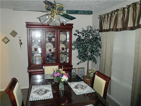 Formal Dining room with ceiling fan