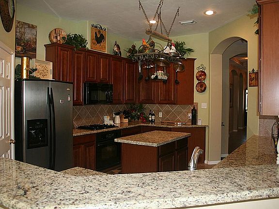 Granite kitchen with cherry cabinets
