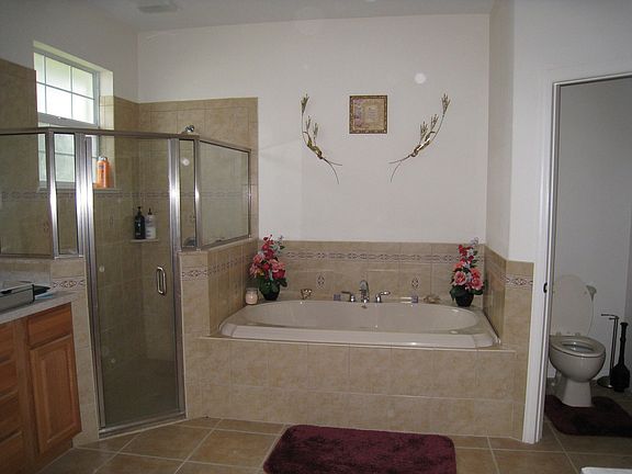 master bathroom with jetted tub, separate shower