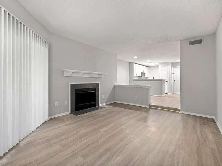 Sunken Living Room with Fireplace In Select Apartment Homes
