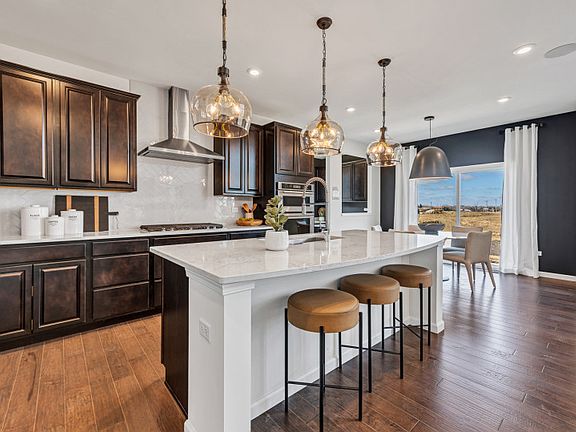 Kitchen with Pendant Lighting and Stainless Steel Appliances