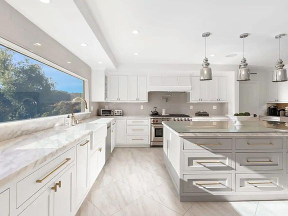 State of the art modern kitchen featuring Wolf appliances.