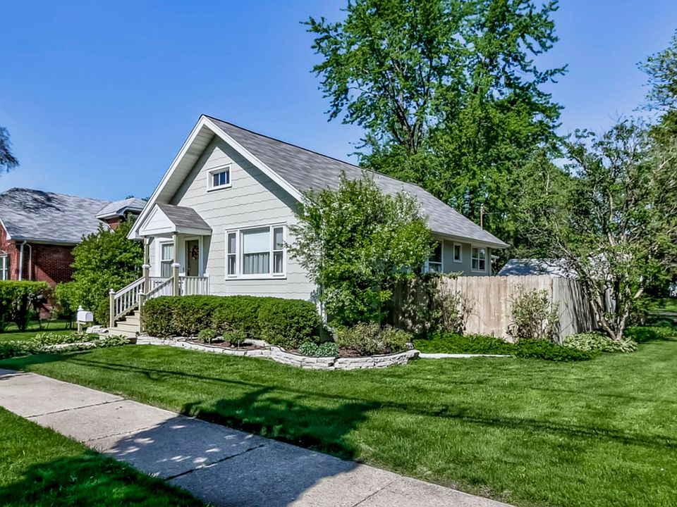 VINTAGE WELL CARED FOR HOME ON CORNER LOT WITH GARAGE ENTRANCE ON SIDE STREET. WALK TO TRAIN