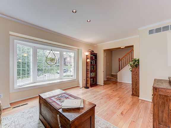 Living room with bay window & hardwoods