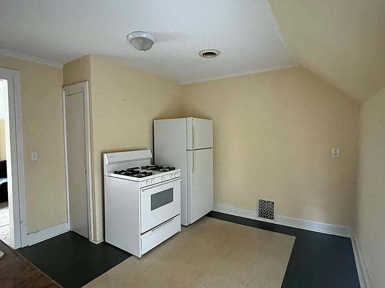Other view of kitchen. Gas stove/oven and fridge included.