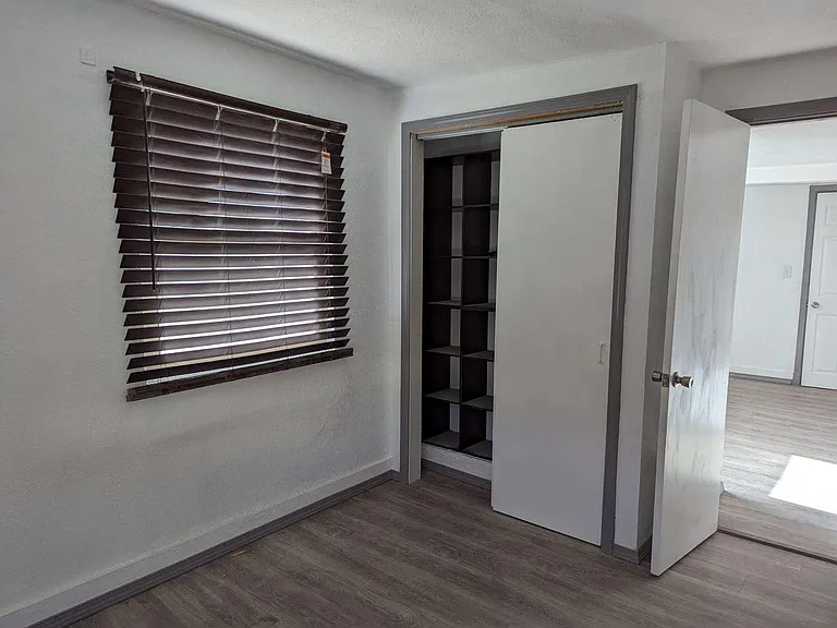 Bedroom with window blinds