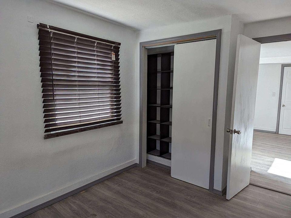 Bedroom with window blinds