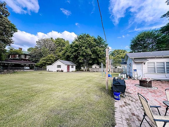 large yard with wired shop