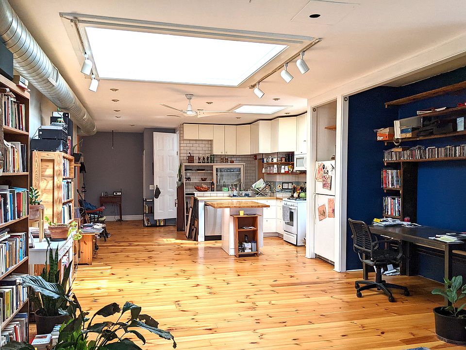 loft with huge skylight with shutters