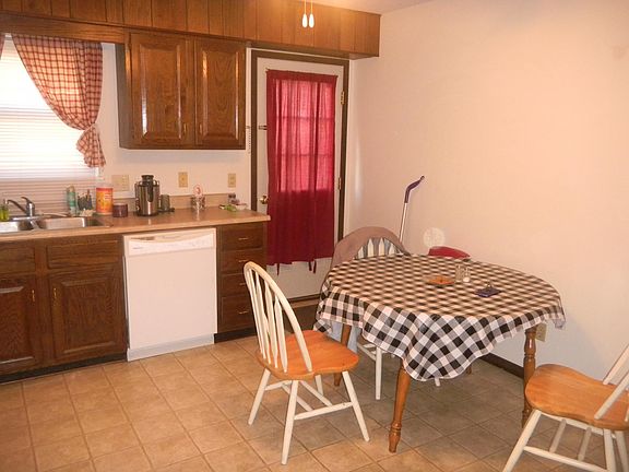 large eatin kitchen and back door to deck
