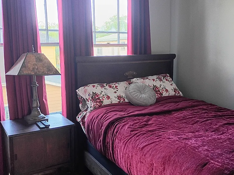 Elevator Bedroom - Full Size Antique Bed with newer mattress and Pillow Top Mattress Pad.