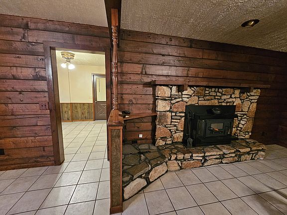 Fireplace. Door into dining room.