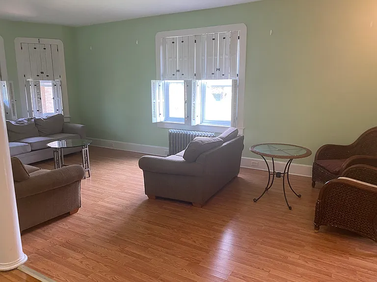 Main Floor Living space with white window shutters