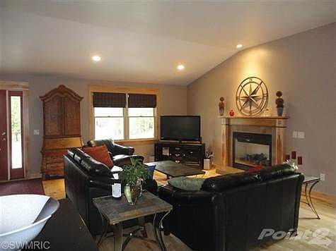 Living room at front of house with gas fireplace