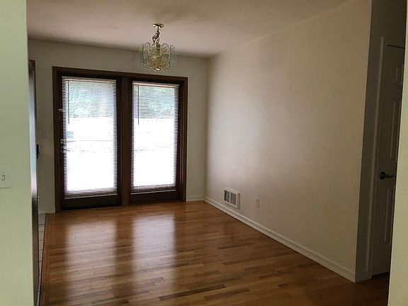 Dining Rm. The door opens to the backyard and deck with the kitchen on left, seen from Lining Rm.