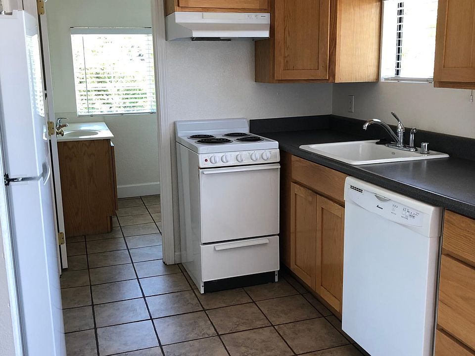 Kitchen with updated refrigerator, electric stove, dishwasher