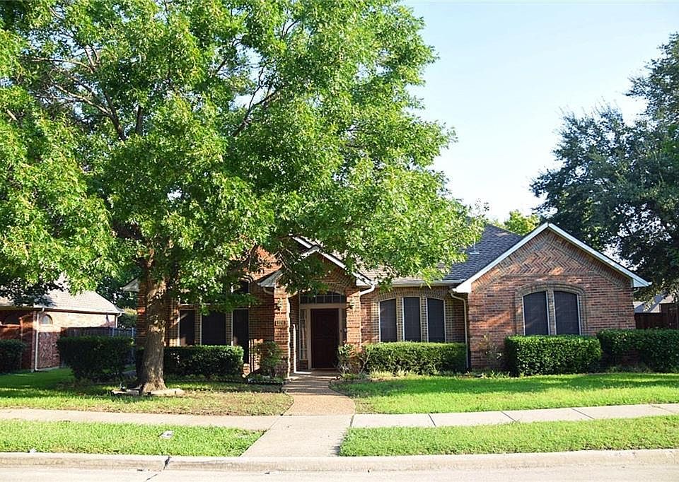 Mature trees in front yard provide plenty of shade in the su