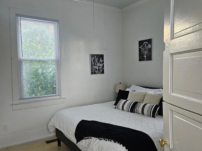 Entering queen bed bedroom