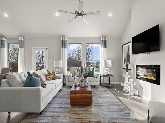 Living room in the Masters home plan by Trophy Signature Homes - REPRESENTATIVE PHOTO