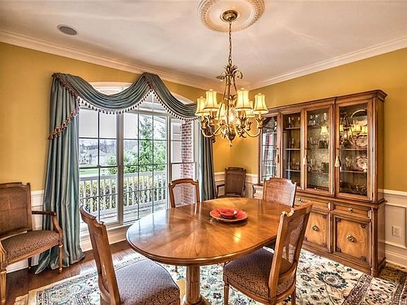 The formal dining room boasting hardwood floors is the picture of elegance.