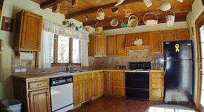 large kitchen w/ expose beam