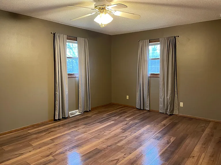Master bedroom with 2 windows and 2 closets.
