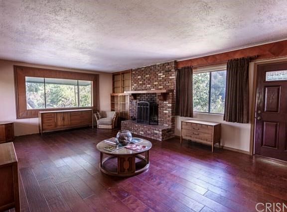 Living Room with wood burning fireplace