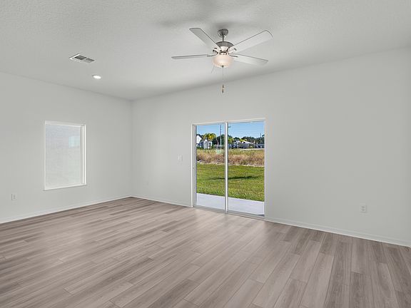 A family room and adjoining dining room