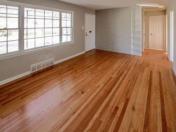 Large livingroom with gleaming hardwood floors