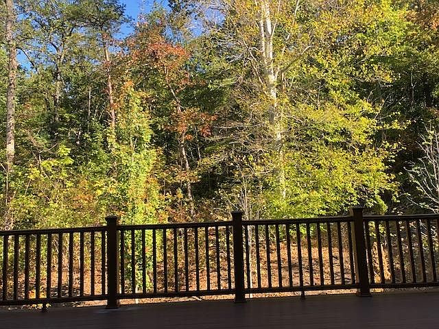 View outside- deck off the kitchen. Private parkland.