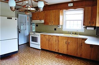 Kitchen has a door that leads to the breezeway