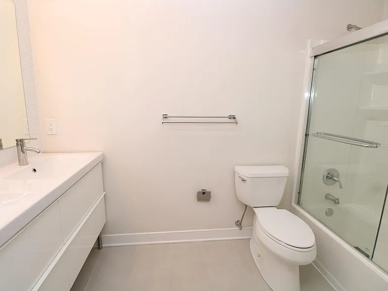 Main bedroom ensuite -- double vanity and shower-tub
