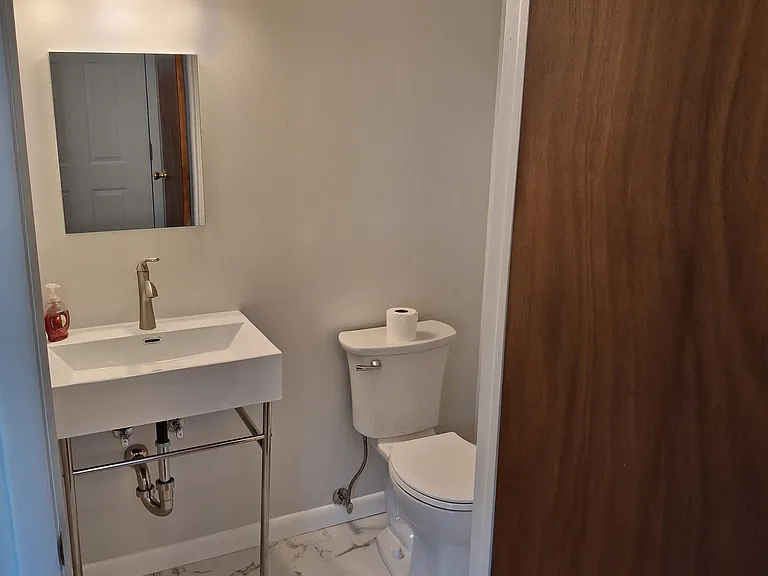 New Powder room near front entrance and Living Room