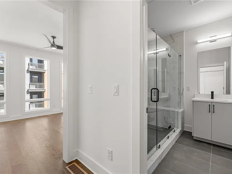 Main Bedroom Entrance (Note: Actual unit has light wooden floors and upgraded fixtures / appliances)