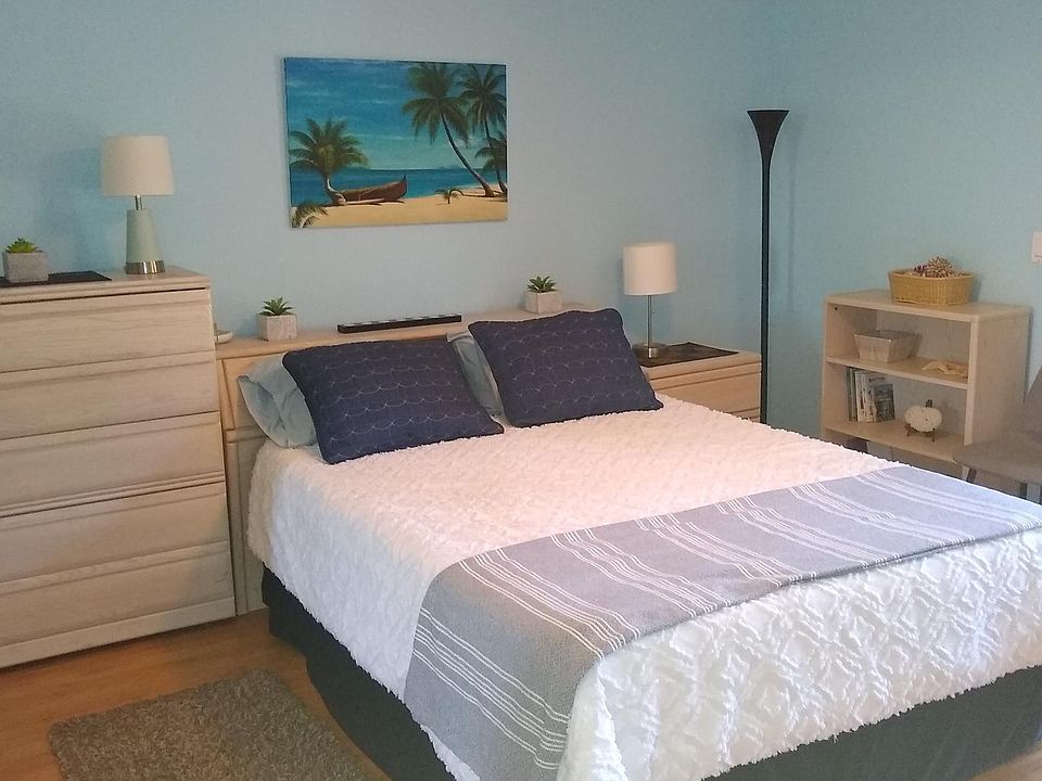 Master bedroom with queen bed, calming beachy decor, ceiling light and fan, lots of storage, and high quality bedding. Sleep well!